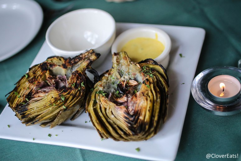 GRILLED ARTICHOKE - A WHOLE ARTICHOKE, STEAMED WITH WHITE WINE & HERBS; BRUSHED WITH OLIVE OIL, GRILLED AND SERVED WITH A MUSTARD AIOLI