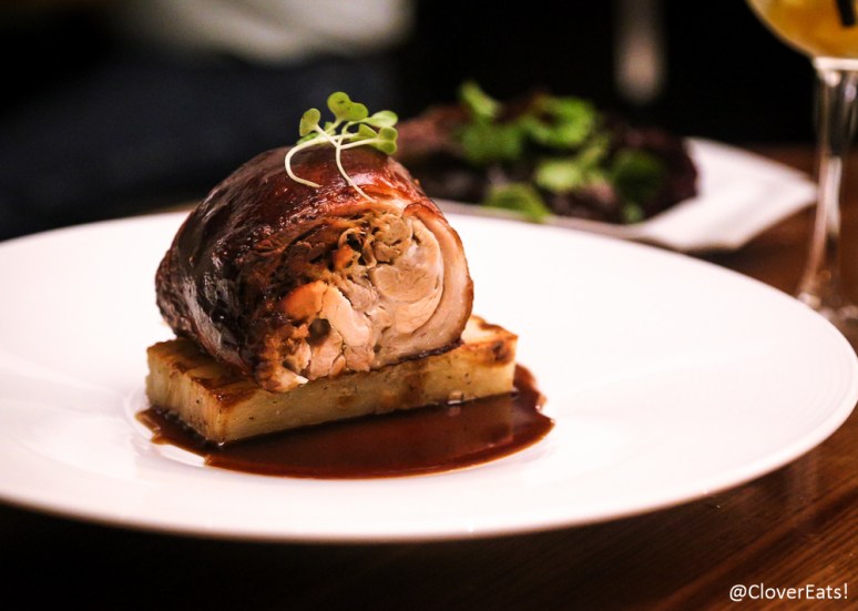 cochinillo roasted boneless suckling pig, lemon, thyme, honey port wine, parmesan cheese dauphinois potato, petit mesclun salad