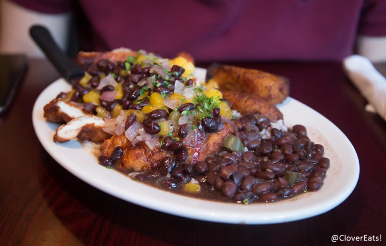 pollo moderno marinated chicken breast breaded and lightly fried served under our mango, guava, pineapple and black bean salsa served with arroz blanco, frijoles negros and platanos maduros