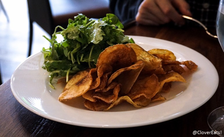 Spicy Salmon Tartare: jalapeno, lemon zest, baby arugula, house made chips 