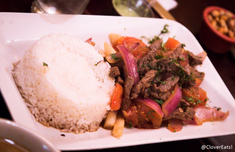 Lomo Saltado - chunks of beef with onions, tomatoes, french fries